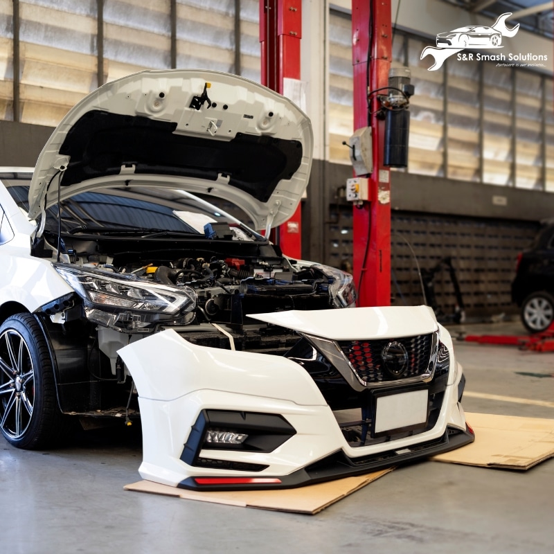An eye-catching front bumper displayed in Beecroft smash repair workshop, ready for installation or repair.
